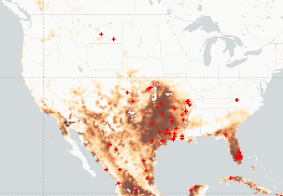 Active fire detections across the United States and Mexico, drawn as red crosses over a dryness layer running cream where the ground holds water and dark brown across the drought-hit interior and the Gulf coast.